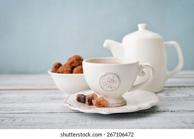 Cup Of Tea And Sugar With Cookies  Over Blue Background