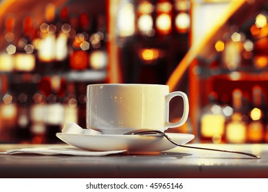 Cup With Tea And Sugar On Plate In Night Club