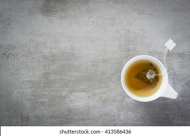 Cup Of Tea With Teabag, On Concrete Stone Background