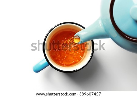 Cup of tea and teapot, isolated on white