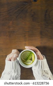 Cup of tea with thyme herb and lemon slices