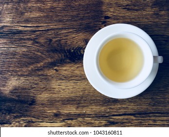 a cup of tea in the wood table background