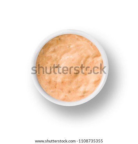 cup of thousand island dressing isolated on a white background