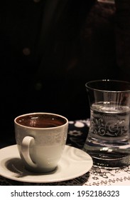 A Cup Of Turkish Coffe And Glass Water