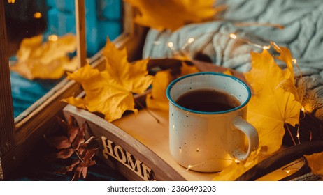 Cup Warm Coffee and Yellow Autumn Leaves by the Window. Fall Season and Home Cozy Concept. Vintage style. - Shutterstock ID 2360493203