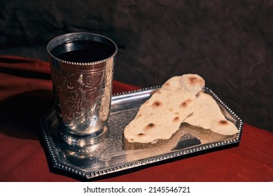 Cup With Wine And Loaves On A Dish For Easter Church Communion About The Sacrifice Of Christ On A Crimson Fabric