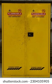 a cupboard made of yellow iron specifically for the storage of hazardous materials. This includes chemicals and flammable materials