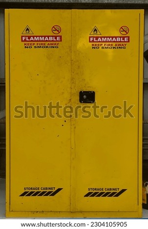 a cupboard made of yellow iron specifically for the storage of hazardous materials. This includes chemicals and flammable materials