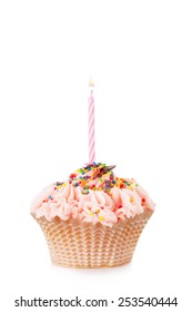 Cupcake With The Burning Festive Candle On A White Background