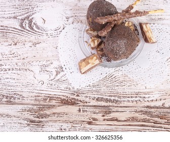 Cupcake with chocolate on wooden background - Shutterstock ID 326625356