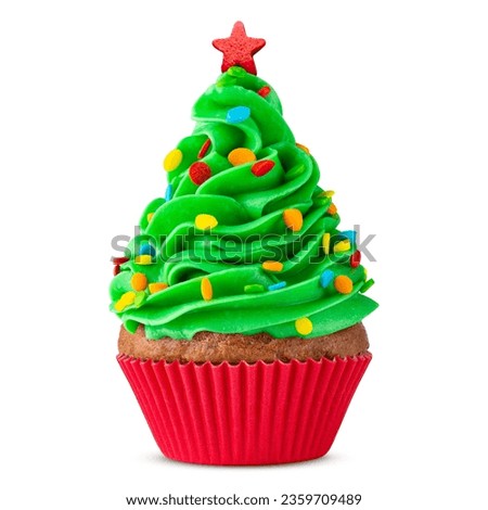 Cupcake. Christmas Tree cupcake with star on top. Red cup liners. Merry Christmas. Tasty baking cupcakes, cake or muffin with green cream icing, frosting and colored sprinkles. Bakery, confectionery. 
