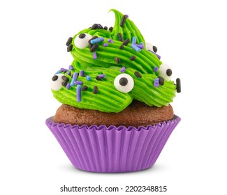 Cupcake. Cupcake on Halloween. Dessert on Halloween party. Chocolate muffin decorated with colored sprinkles, green frosting and Icing. Close-up macro high quality, resolution photo. Isolated on white - Powered by Shutterstock