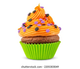 Cupcake On Halloween. Dessert On Halloween Party. Muffin Decorated With Colored Sprinkles, Candy, Orange Frosting And Icing. Chocolate Cupcake Or Cake. Macro High Quality Food Photo. White Background