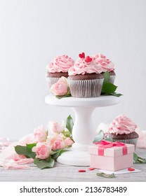 Cupcake With Pink Frosting And Rose