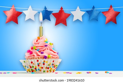 Cupcake And Stars. Happy Birthday, 4th Of July, Independence, Memorial Or Presidents Day. Tasty Cupcakes With Pink Cream Icing And Colored Sprinkles. Burning Candle In A Cake. Sweet Delicious Dessert.