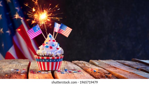 Cupcake Usa Celebration With American Flags And Sparkler - Powered by Shutterstock