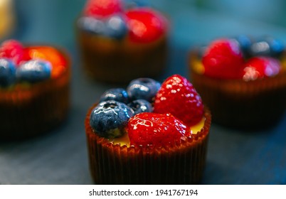 Cupcakes With Berries For Lunch In Pastry Cafe.Delicious Bakery Products Stored In Fridge.Download Royalty Free Image Of Cupcakes.Download Royalty Free Curated Images Collection With Foods Foods