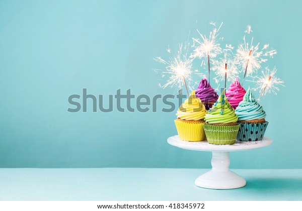 Cupcakes on a cake stand\
with sparklers