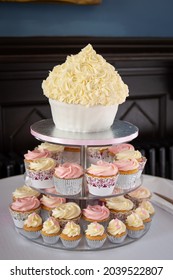 Cupcakes On A Stand In The Shape Of A Big Cake For A Wedding Reception