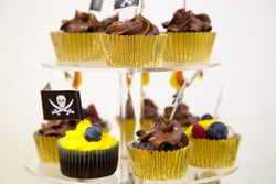Cupcakes On Stand In Yellow And Black Colors, Pirate Theme For Kids Birthday Party