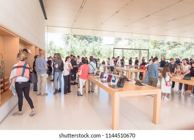 CUPERTINO, CA, US-JUL 18, 2018:Diverse group of customer experience highly curated selection of iPhone, iPad, computer product, accessories, exclusive and Apple Park–branded at Apple Park retail store