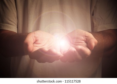 Cupped Hands Of A Man With Light Source. Holding, Giving, Reaching, Taking Concept.