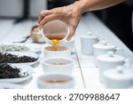 Cupping or testing the quality of the tea