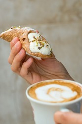 Cups Of Cappuccino And Fresh Ricotta Cannoli Dessert In Coffee Bar In Sicily, Italy. Cannoli Is A Traditional Sicilian Dessert