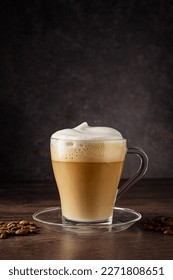 Cups of coffee drink, latte or mocha with milk foam. Glass mug, dark wooden background