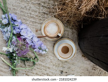 Cups Of Coffee And Flowers On The Set Of A Photo Shoot