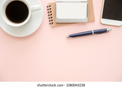 A Cups Of Coffee On Pastel Pink Table In Minimal Style With Blank Name Card Case,note Book,smart Phone,luxury Pen In  Top View. Business Meeting Concept