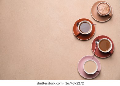 Cups Of Different Coffee On Color Background