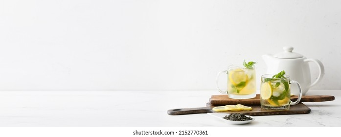 Cups of tasty iced green tea on white background with space for text - Shutterstock ID 2152770361