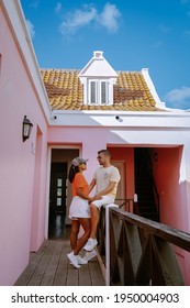 Curacao, Colorful Bouldings Around Willemstad Punda And Otrobanda Pietermaai District, Multicolored Homes In Pietermaai Curacao Caribean Island , Couple Men And Woman On Vacation Curacao