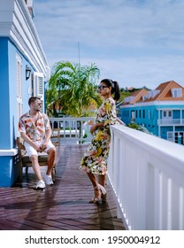 Curacao, Colorful Bouldings Around Willemstad Punda And Otrobanda Pietermaai District, Multicolored Homes In Pietermaai Curacao Caribean Island , Couple Men And Woman On Vacation Curacao