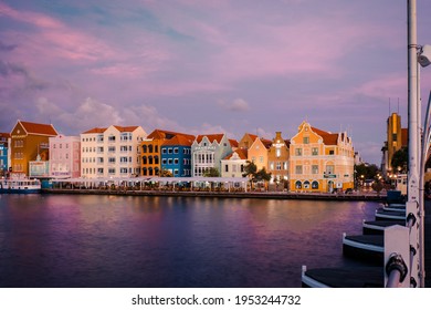 Curacao Willemstad March 2021, Sunset At The Colorful City Of Willemstad With People Walking At The Flooten Bridge