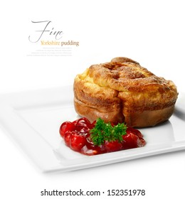 A Curated Image From My FINE Series Set. Macro Image Of A Yorkshire Pudding With Redcurrant Jelly Against A White Background. My Late Father's Recipe, Passed Down. Copy Space.