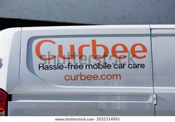 Curbee sign on mobile\
car care service vehicle parked at customer location - San Jose,\
California, USA - 2021