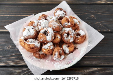 Curd Rings With Topping From Powder In A Plate On A Wooden Background