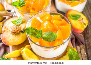 Curd Or Yogurt Dessert With Canned And Fresh Peaches, On Wooden Rustc Background. Summer Breakfast Fruit Dessert.