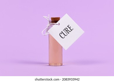 Cure in glass vial with label on violet background - Shutterstock ID 2083933942