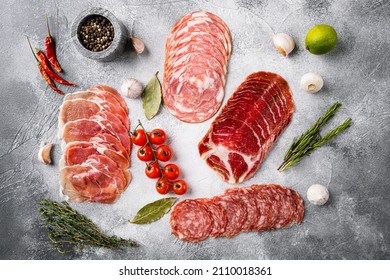 Cured Italian Meat Ham, Prosciutto, Pancetta Set, On Gray Stone Table Background, Top View Flat Lay