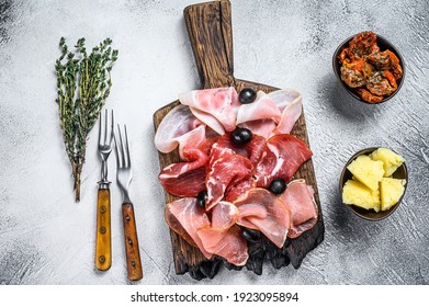 Cured Meat Platter Of Traditional Spanish Tapas. White Background. Top View