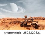 Curiosity Mars Rover exploring the surface of red planet with Saturn planet background. Elements of this image furnished by NASA.