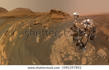 NASA’s Curiosity Mars rover on Mars surface with Mont Mercou. Elements of this image furnished by NASA 