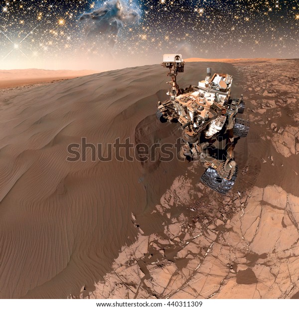 Curiosity rover exploring\
the surface of Mars. Retouched image. Elements of this image\
furnished by NASA.