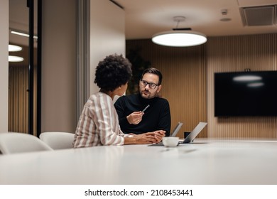 Curious african-american woman, listening to her mentor in the company. - Shutterstock ID 2108453441