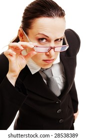 curious businesswoman holding her glasses against dark background - Shutterstock ID 28538389