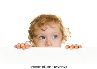 Curious Cute Child Looking Over The Table Edge