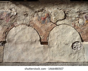 Curious Detail Of Old Wall In The Street With Traces Of Trick Polychromy. City Of Bergamo. Italy.